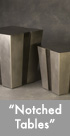 Thumbnail image of two stainless steel tables with notches up the side.