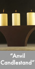 Thumbnail image of a bronze anvil-shaped candlestand.