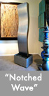 Thumbnail image of a large bronze and stainless steel water feature.